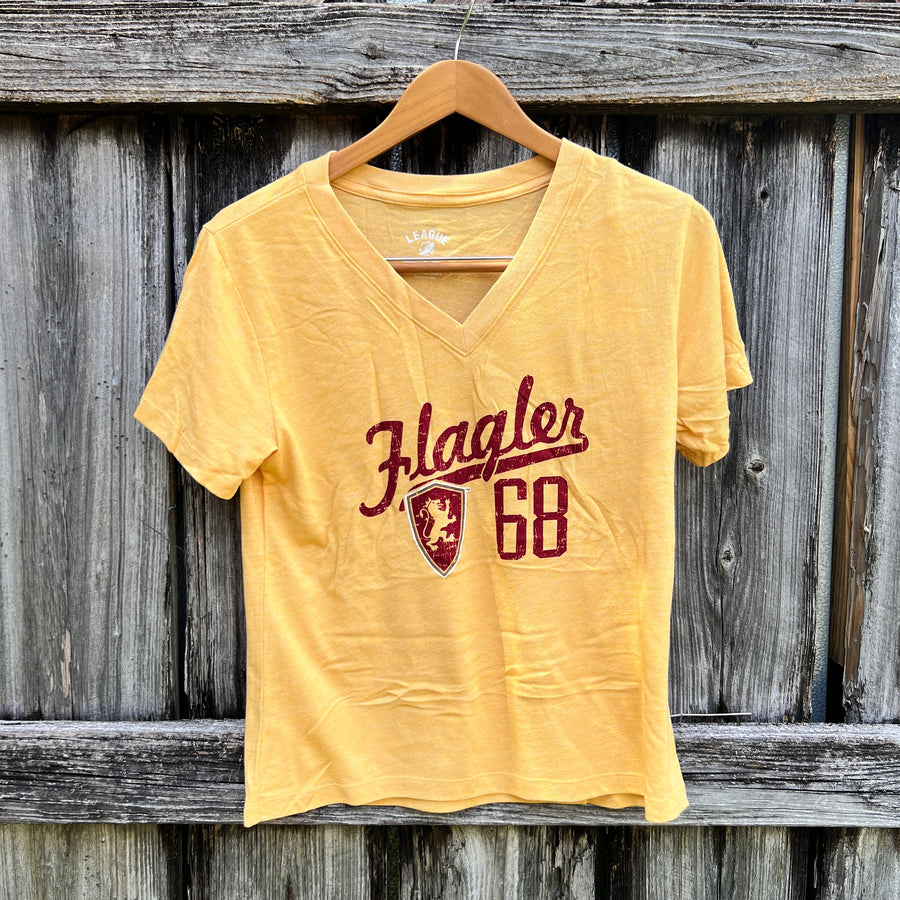 Heather Red and Heather Gold V-neck with imprints saying Flagler over Flagler shield logo and 68
