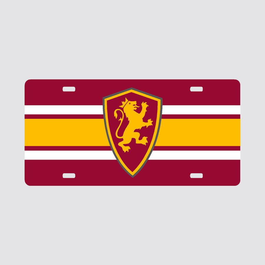 White front license plate cover with yellow line over crimson line over yellow line with Flagler College shield logo in center