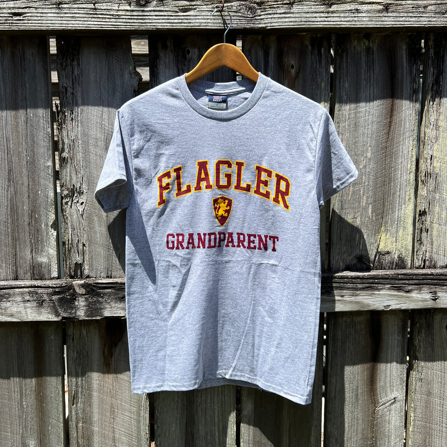 Grey t-shirt with crimson imprint outlines with yellow saying Flagler over Flagler shield logo over crimson imprint saying Grandparent