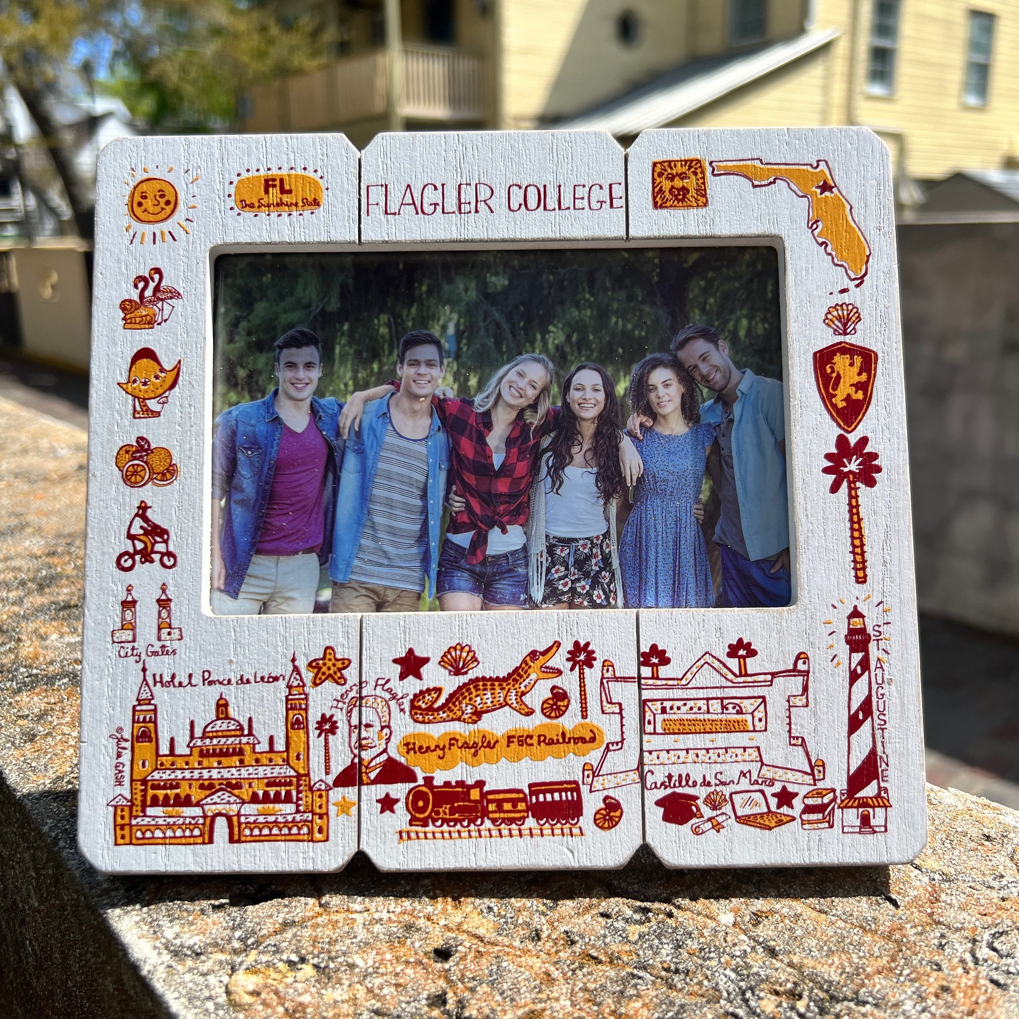 White picture frame with Julia Gash design including Flagler College, Henry Flagler, Castillo de San Marco, Alligator, etc