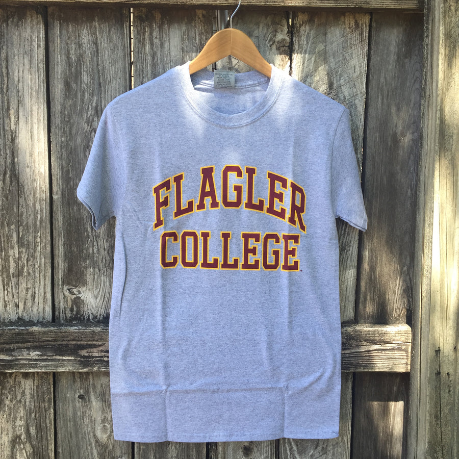 Grey t-shirt with crimson imprint saying Flagler College outlined in gold