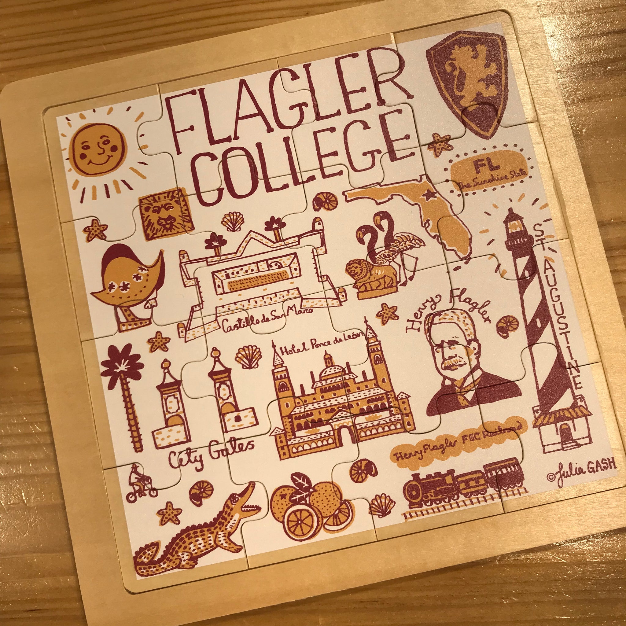 white wooden puzzle with Julia Gash design including Flagler College, Henry Flagler, Castillo de San Marco, Alligator, etc