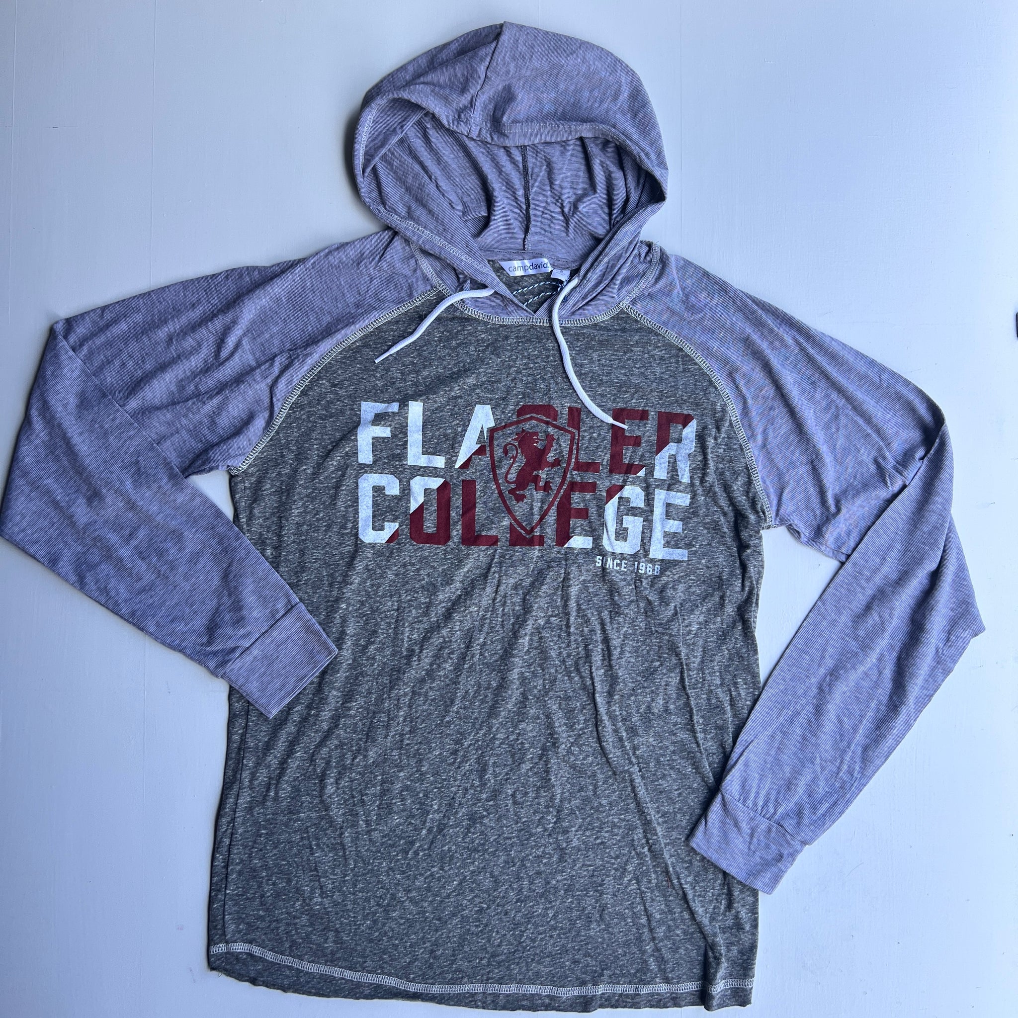 Grey lightweight  hooded sweatshirt with white and crimson imprint saying Flagler over Flagler College shield logo over College over since 1968