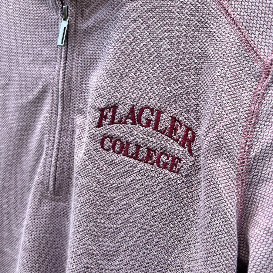 Crimson quarter zip with darker crimson imprint saying Flagler over college on left side 