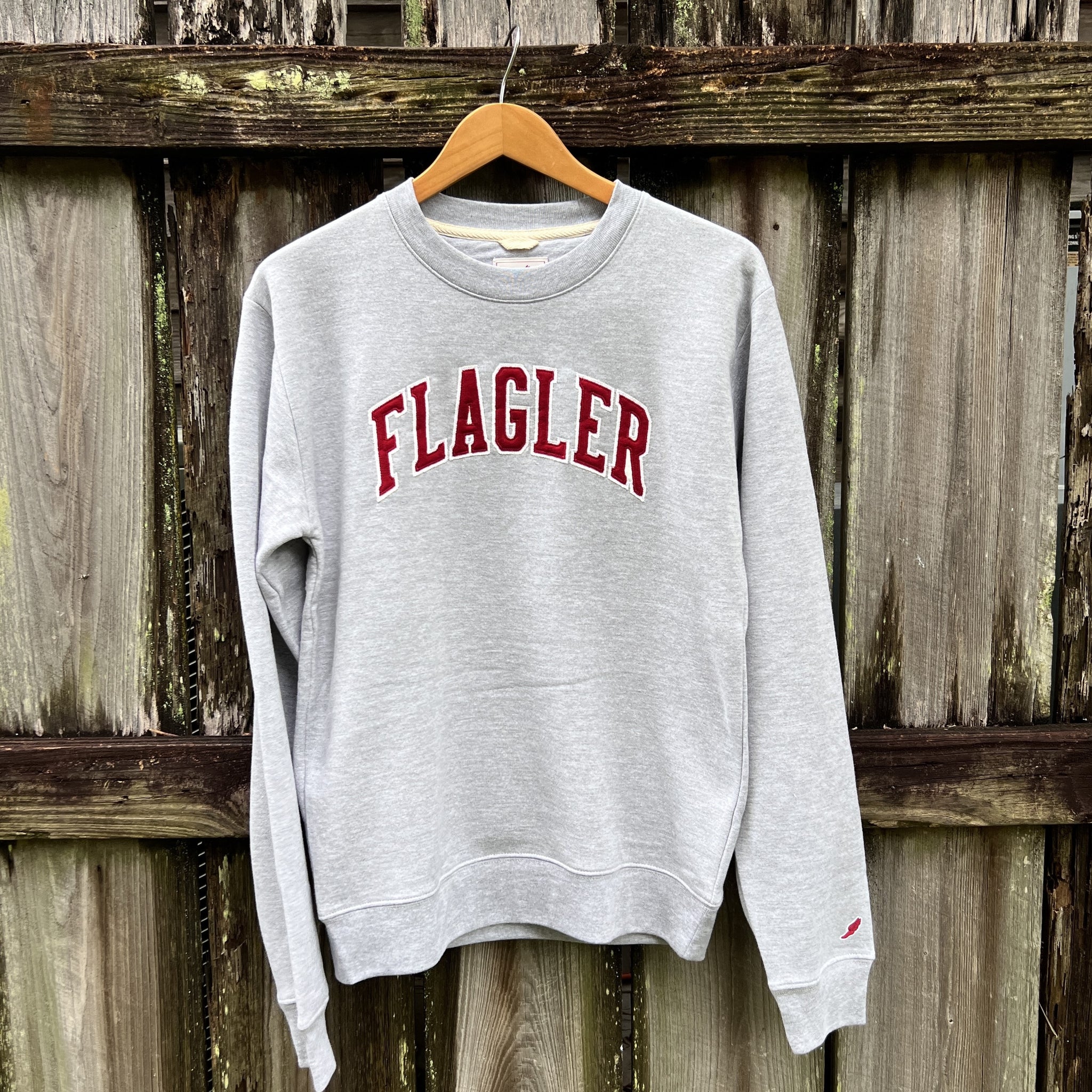 Oxford Grey crewneck sweatshirt with arched crimson embroidering saying Flagler