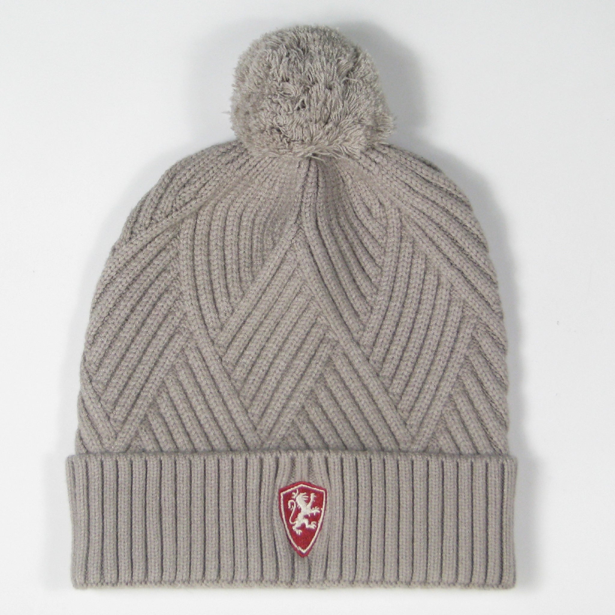 Front of grey textured cuff beanie with embroidered Flagler College Shield logo with pom