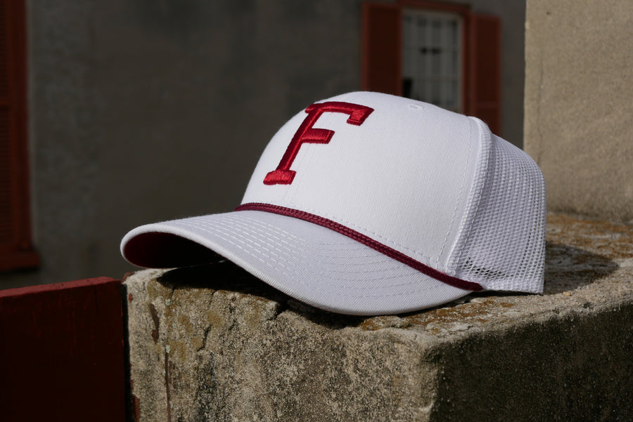 White hat with white mesh back. Red f in center over red rope