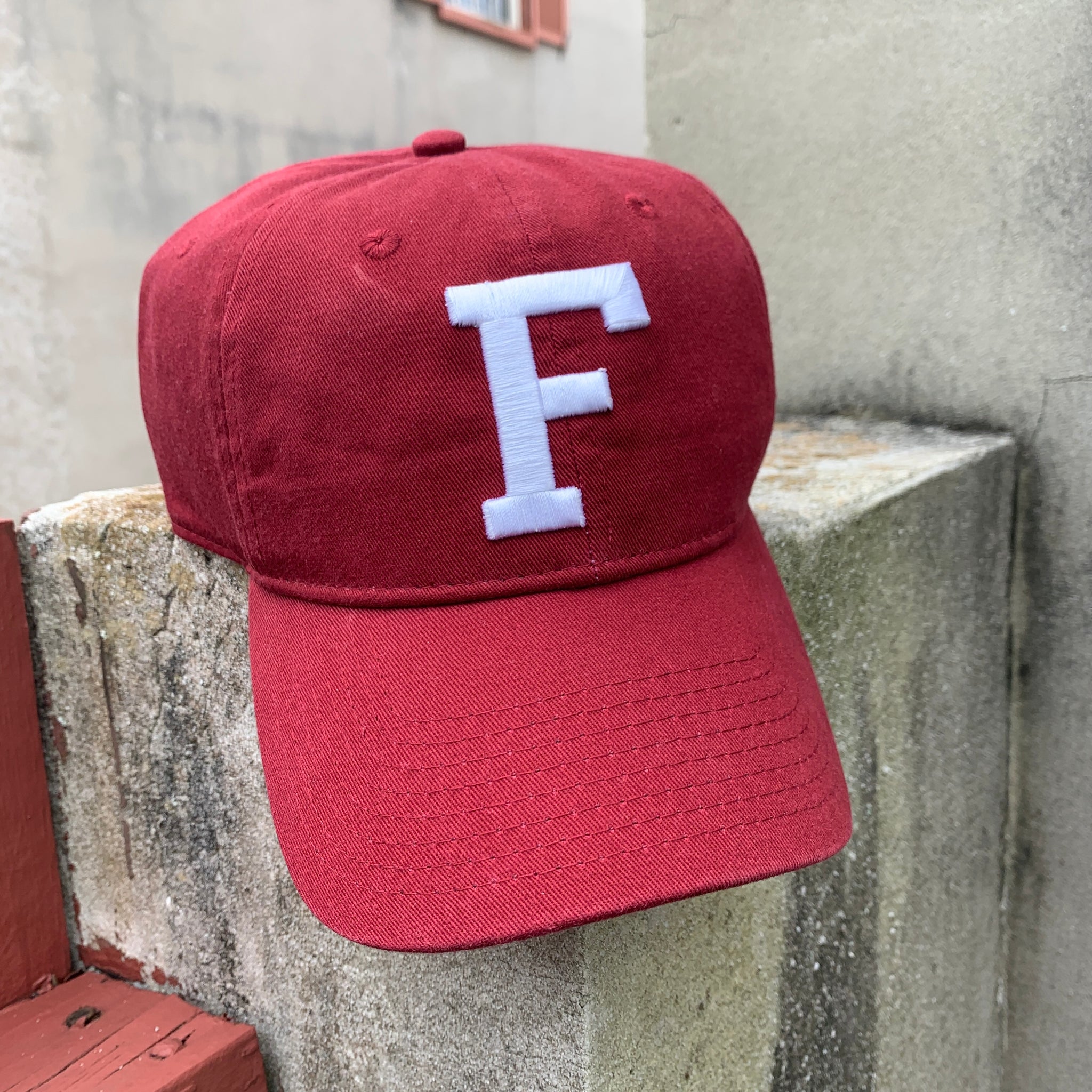 Crimson red hat with white F in center