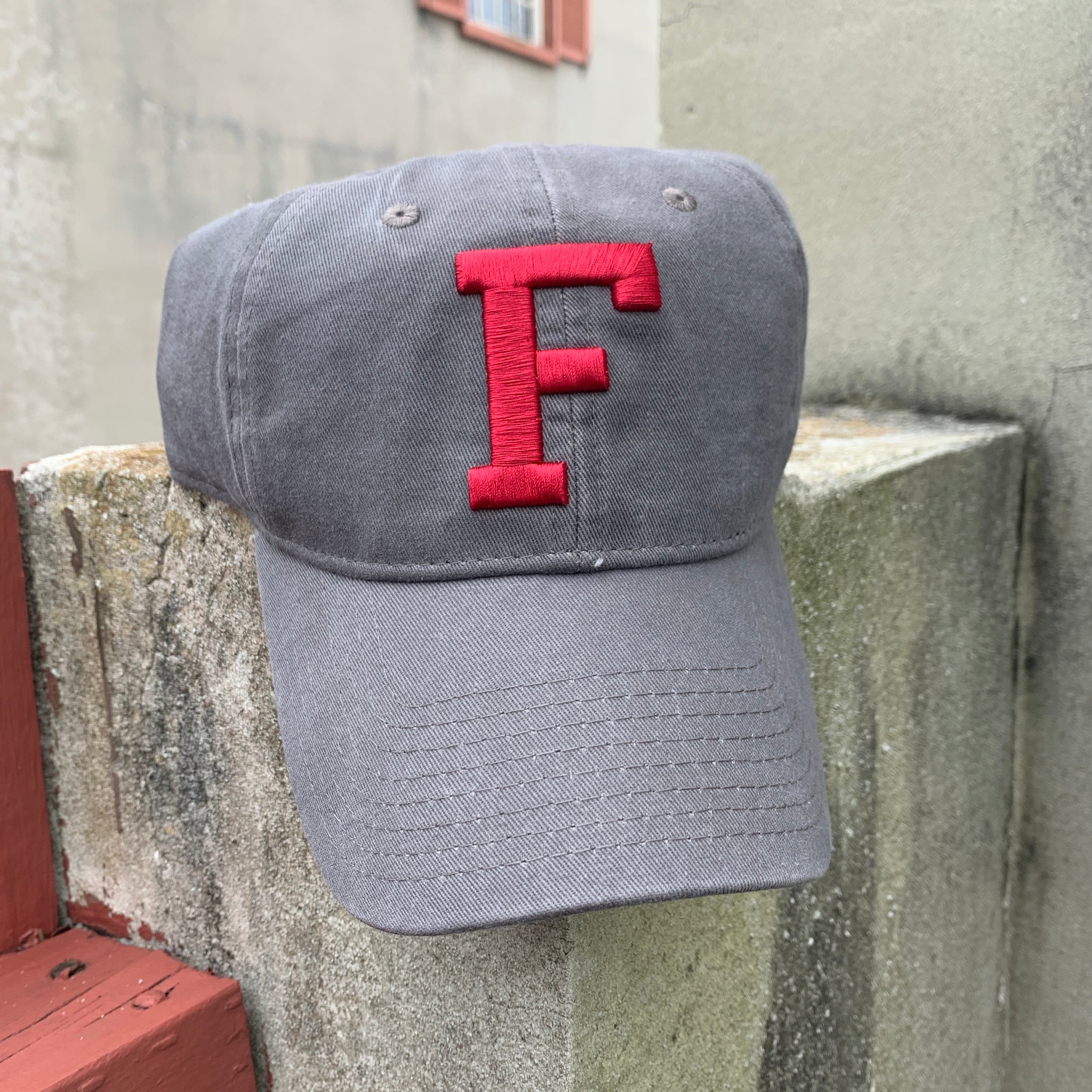 Charcoal hat with embroidered crimson red F in center