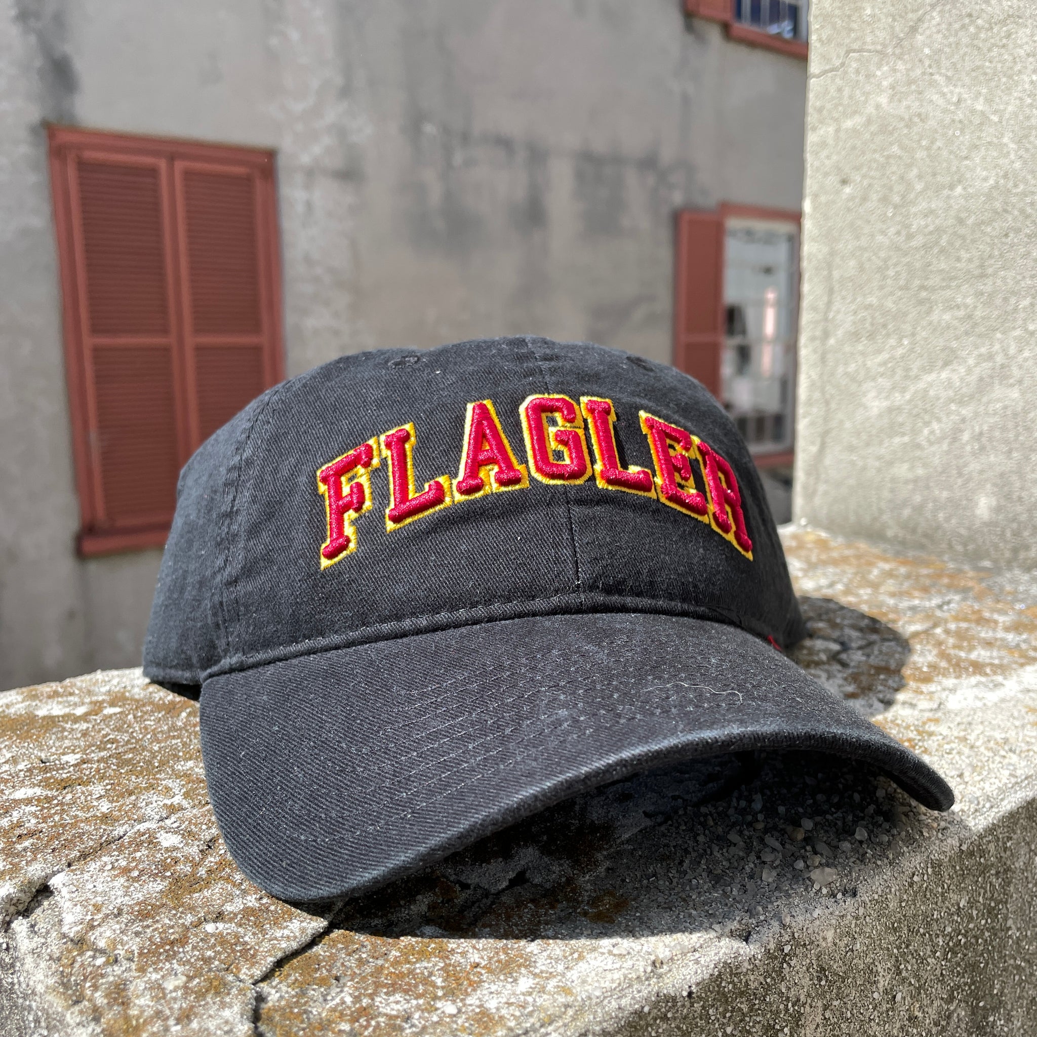 Black hat with red letters saying Flagler