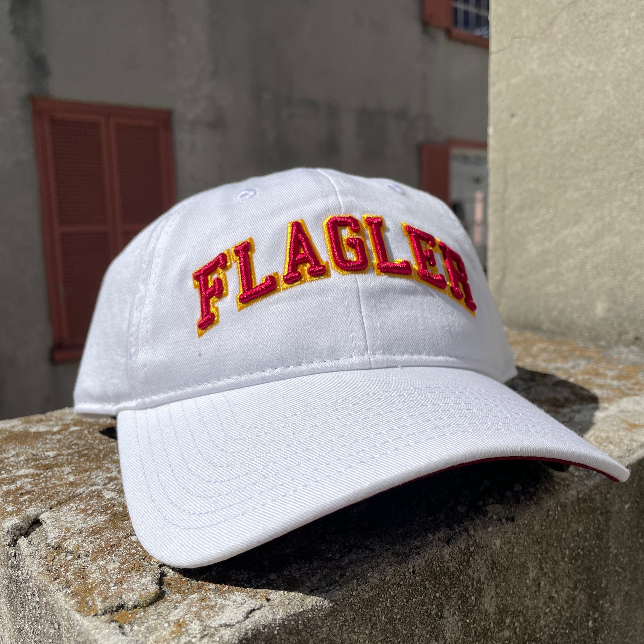  White hat with red letters saying Flagler.