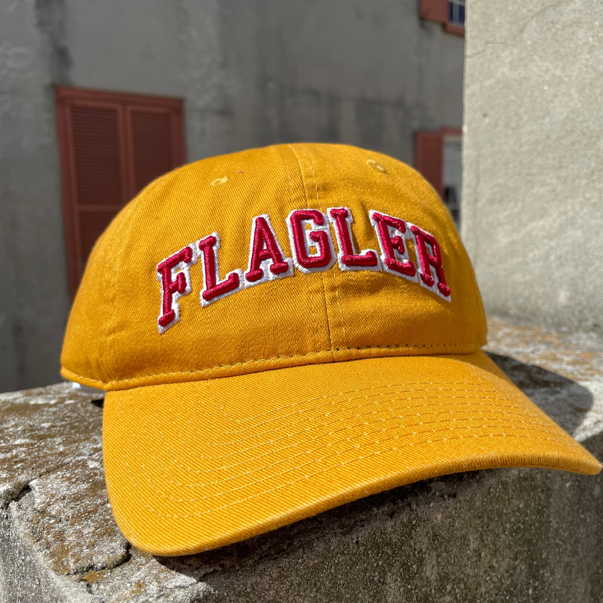 Yellow Hat with red letters saying Flagler.