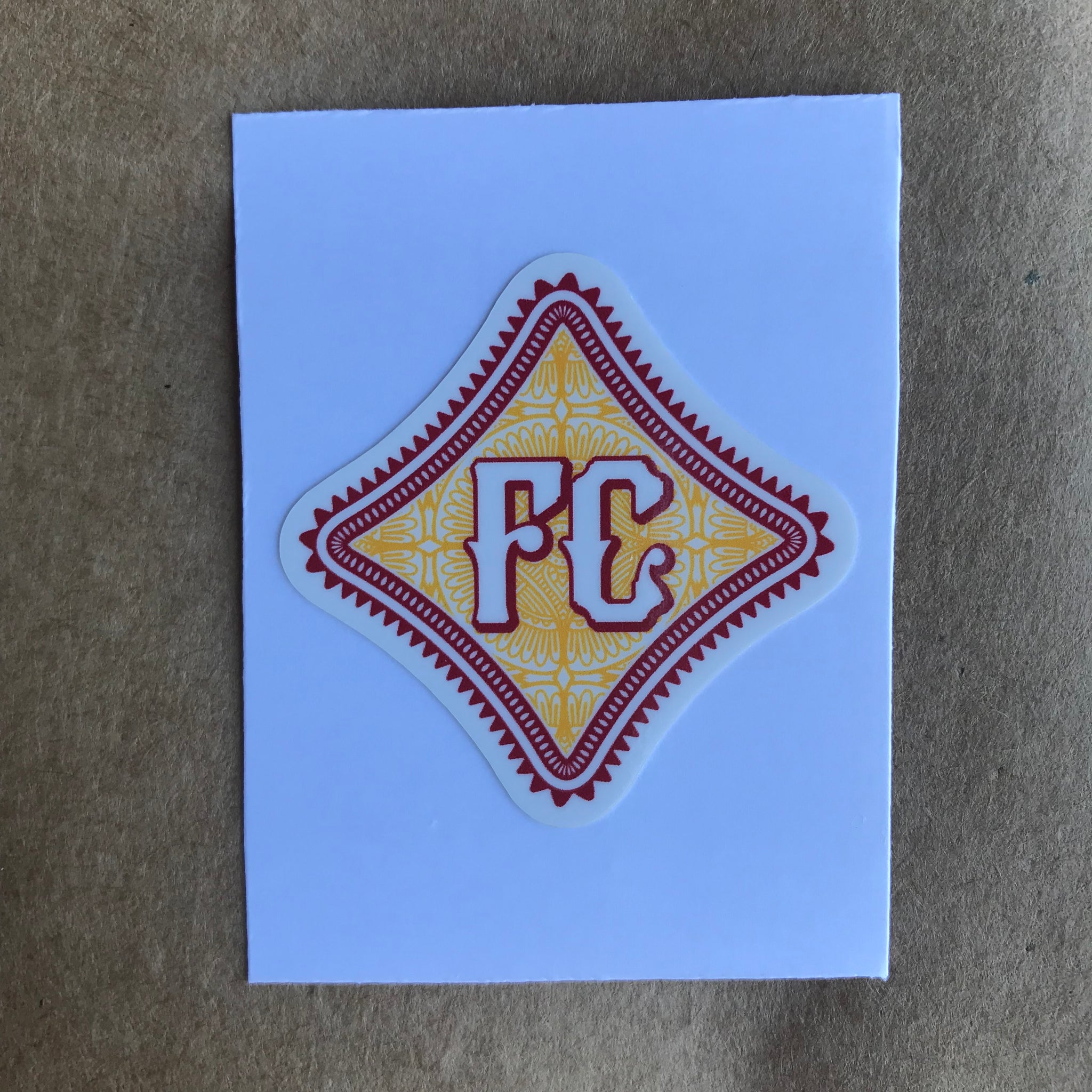 F C Diamond Mini Sticker with red and yellow ornate patterns 