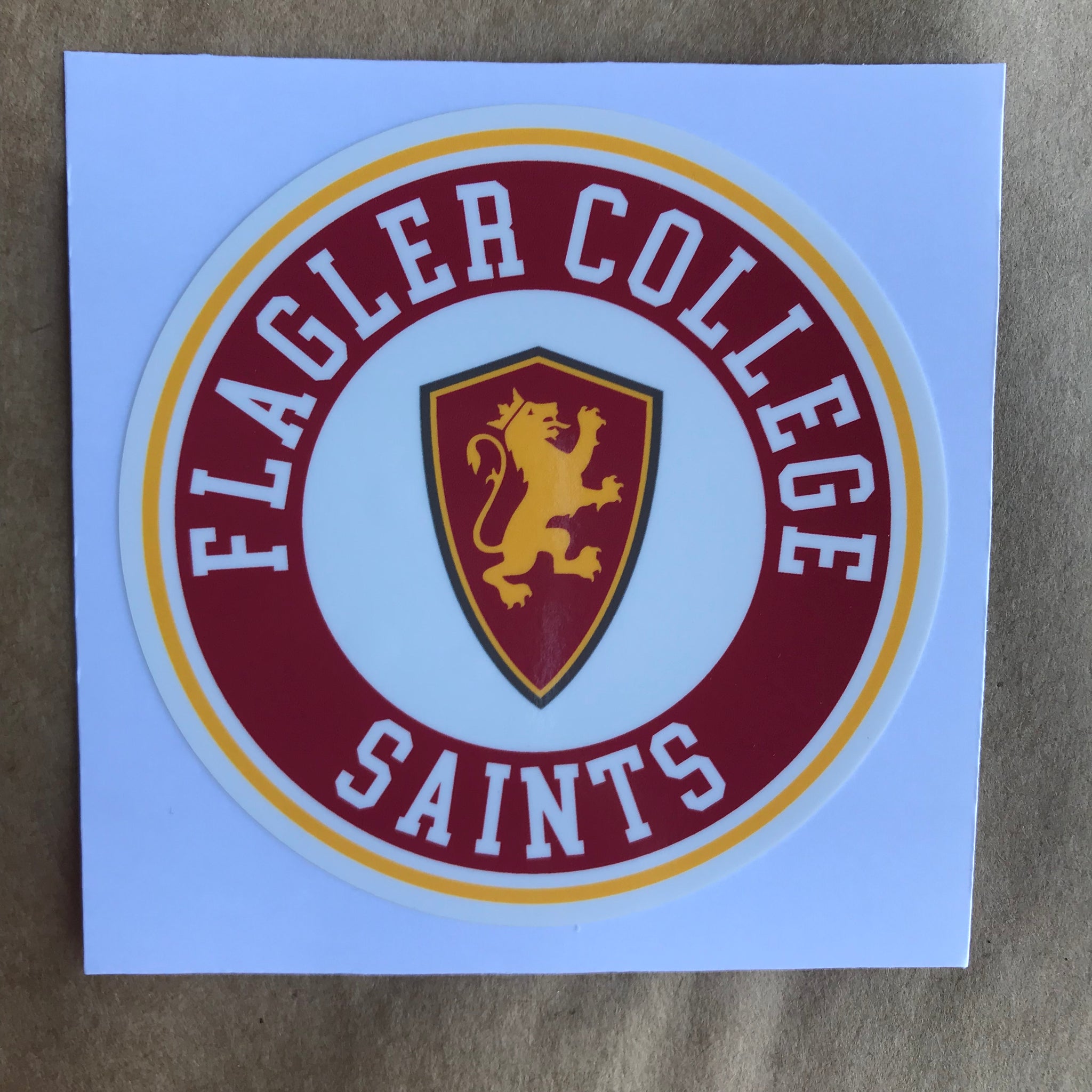 red, yellow and white Flagler college saints round sticker