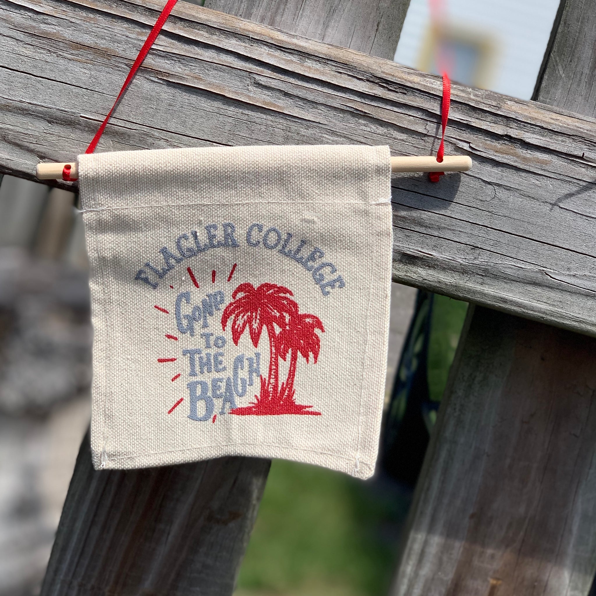 "Gone to the Beach" canvas sign with red palm trees