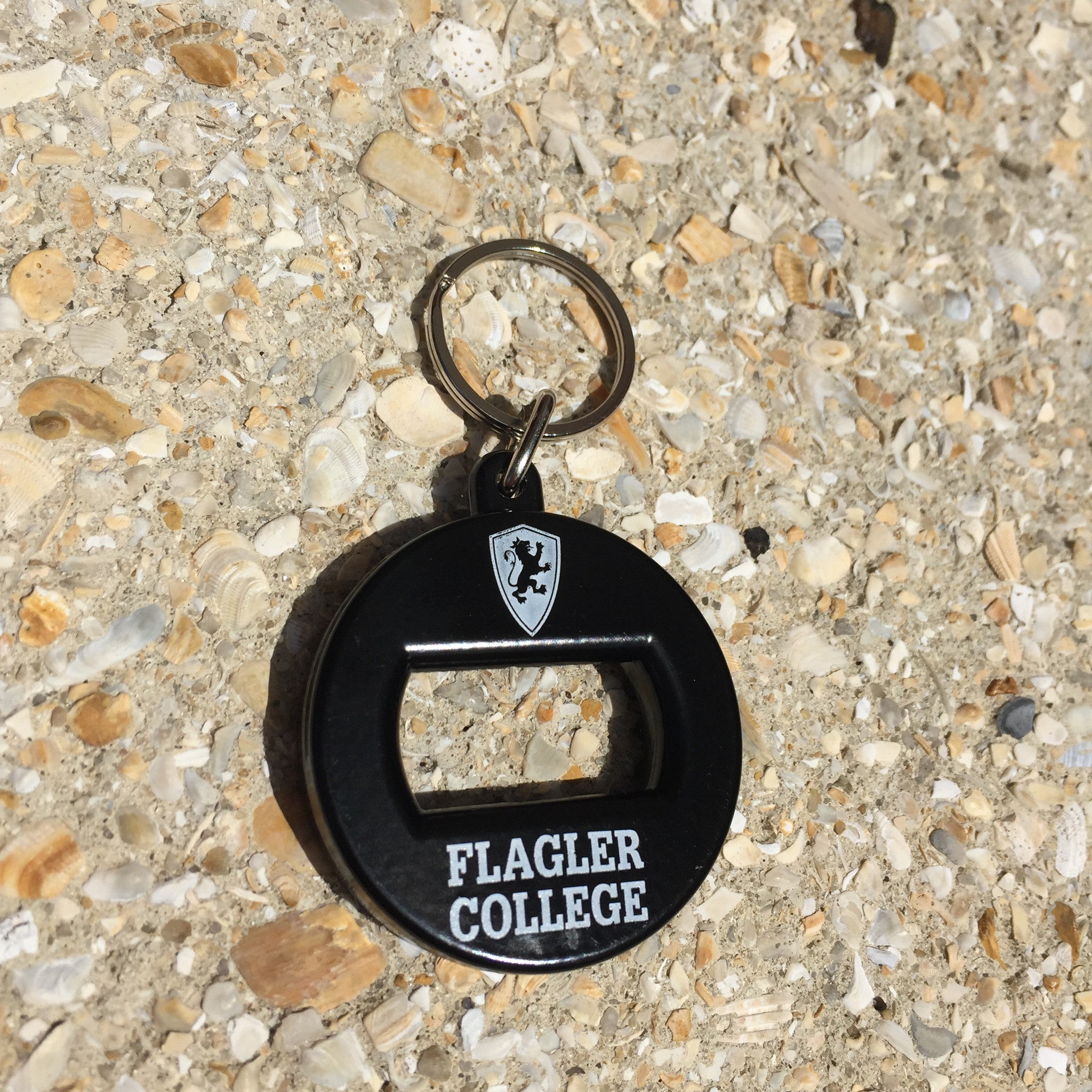 Black Flagler College bottle opener keytag