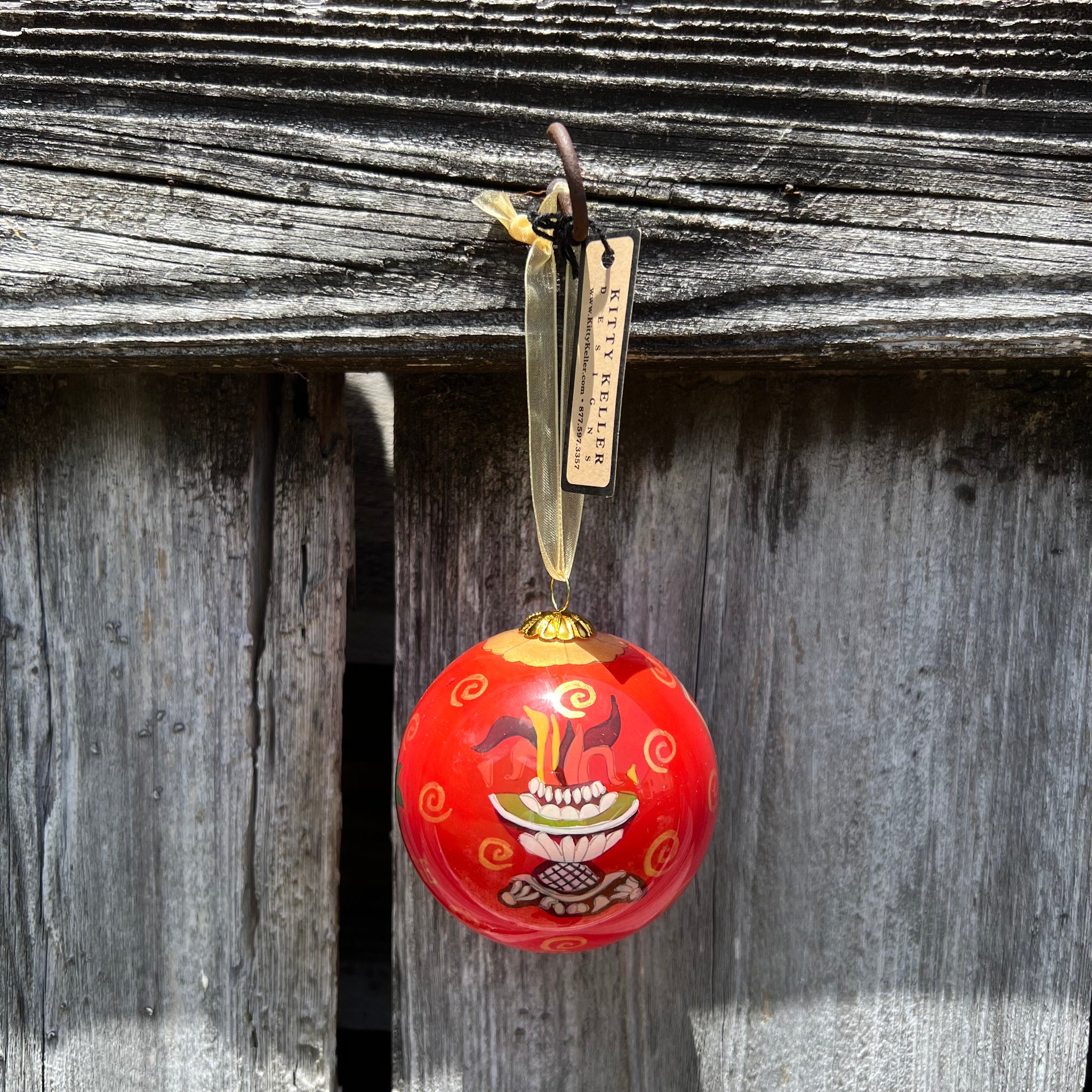 Red hand painted ornament with fountain