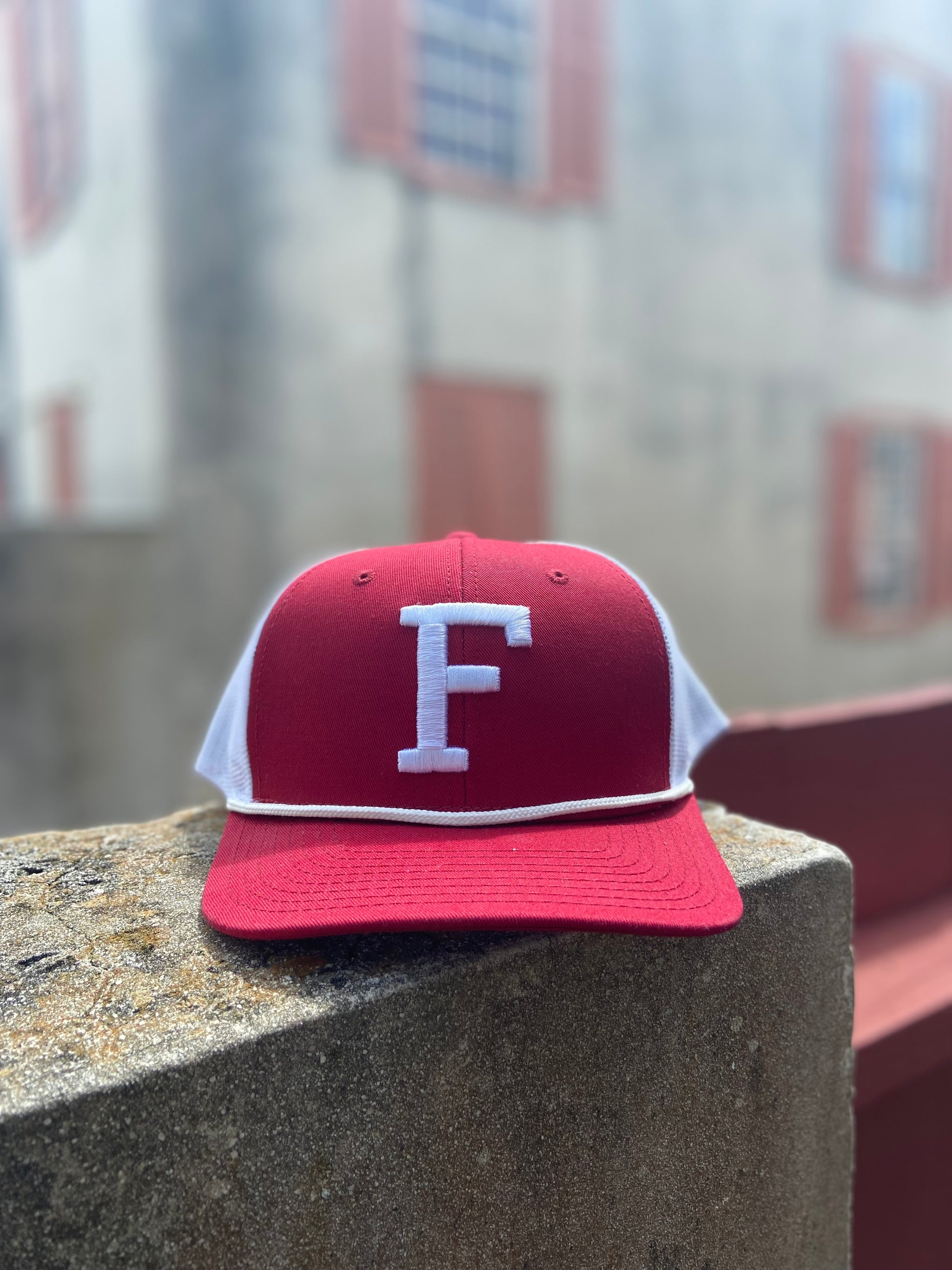 Crimson hat with white mesh back. White F in center over white rope